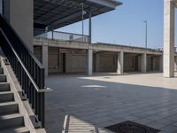 the empty parking lot is full of concrete pillars and balks, but only one person in it