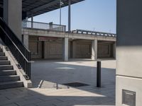 the empty parking lot is full of concrete pillars and balks, but only one person in it