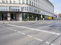 the road is empty, waiting people to cross it at the intersection of a city street