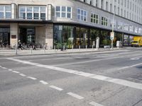the road is empty, waiting people to cross it at the intersection of a city street