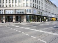 the road is empty, waiting people to cross it at the intersection of a city street