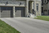 two garages and a driveway at an upscale house in the suburbs of toronto, ontario