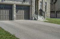 two garages and a driveway at an upscale house in the suburbs of toronto, ontario