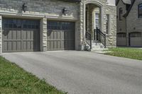 two garages and a driveway at an upscale house in the suburbs of toronto, ontario