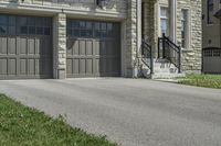 two garages and a driveway at an upscale house in the suburbs of toronto, ontario