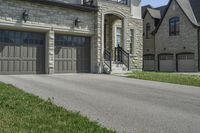 two garages and a driveway at an upscale house in the suburbs of toronto, ontario