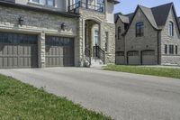 two garages and a driveway at an upscale house in the suburbs of toronto, ontario