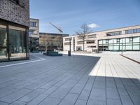 the empty courtyard has various bricks on it to make sure if the building is built in