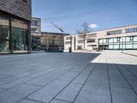 the empty courtyard has various bricks on it to make sure if the building is built in