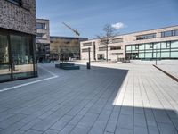 the empty courtyard has various bricks on it to make sure if the building is built in