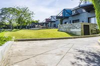 Residential Area with Lush Grass in Thailand under a Clear Sky