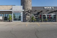 a large building with a clock on the outside of it's front door and grass in front