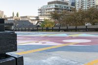 the crosswalk is painted with an array of circles and colors in the city streets