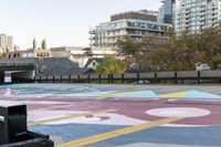 the crosswalk is painted with an array of circles and colors in the city streets