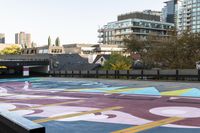 the crosswalk is painted with an array of circles and colors in the city streets