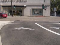 a stop light sitting at the intersection of an intersection on a street corner with no traffic