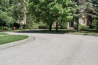 a suburban neighborhood with trees, houses and lawns around the corner of the street