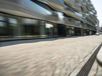 a blurred shot of the cityscape of downtown portland, oregon with cars driving on a street