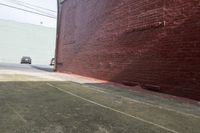 a man is on the side of a building using a skateboard to pull his balance