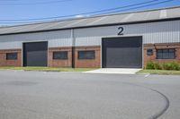 the building has two separate garages with a car garage attached to it's front