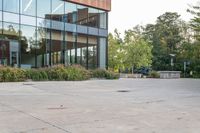 there is a woman riding a skateboard in front of a building outside of it