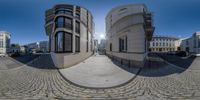 this is a mirror image of a residential complex in a city as seen on a 360 - view mirror