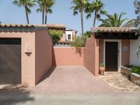 an entrance and garage are open on the patio of this home in the neighborhood of santa ferez,