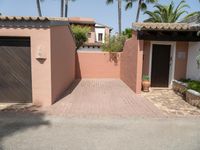 an entrance and garage are open on the patio of this home in the neighborhood of santa ferez,