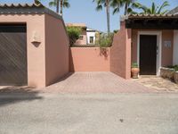 an entrance and garage are open on the patio of this home in the neighborhood of santa ferez,