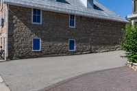 this building is brick and stone with an arched window, and it's shinning