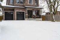 a large brown brick home in the snow with trees in front of it and the driveway covered with snow