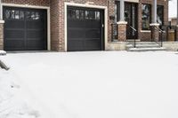 a large brown brick home in the snow with trees in front of it and the driveway covered with snow