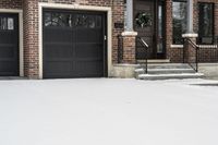 a large brown brick home in the snow with trees in front of it and the driveway covered with snow