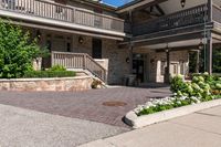 the entrance to the large brown building with lots of stone walls and stairs leading up to the front door