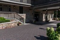 the entrance to the large brown building with lots of stone walls and stairs leading up to the front door