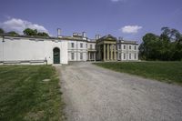 an image of a house from the side in a park setting on a sunny day