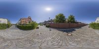 a street and some houses around it with 360 - panes of images showing off