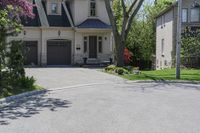 a neighborhood with two rows of houses and trees outside the house is empty from the front door