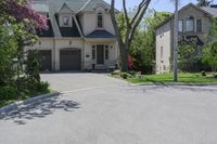 a neighborhood with two rows of houses and trees outside the house is empty from the front door