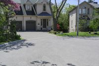 a neighborhood with two rows of houses and trees outside the house is empty from the front door