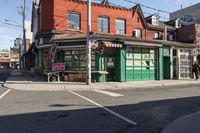 a small business sits in the middle of an urban neighborhood with no traffic, on a street corner