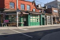 a small business sits in the middle of an urban neighborhood with no traffic, on a street corner