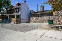 Residential Parking Lot Entry Under Clear Sky