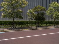 empty road with white lines on the streets of city area against cloudy blue sky on a sunny day