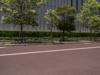 empty road with white lines on the streets of city area against cloudy blue sky on a sunny day