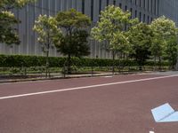 empty road with white lines on the streets of city area against cloudy blue sky on a sunny day