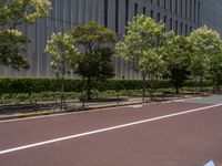 empty road with white lines on the streets of city area against cloudy blue sky on a sunny day