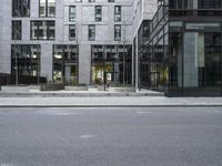 the empty street with a number of buildings in the background that appear to be in different places