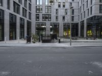 the empty street with a number of buildings in the background that appear to be in different places