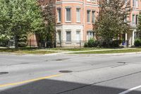 a street with buildings and a blue fire hydrant on it's curb and sidewalk